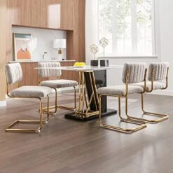 Zesthouse Mid-Century Modern Dining Chairs With Gold Metal Base, Accent Armless Kitchen Chairs With Channel Tufting, Upholstered Boucle Fabric Side Chairs, Set Of 2, Grey Khaki 11 Zesthouse Mid-Century Modern Dining Chairs With Gold Metal Base, Accent Armless Kitchen Chairs With Channel Tufting, Upholstered Boucle Fabric Side Chairs, Set Of 2, Grey Khaki -Amazon Store 51SwPV0zXfL