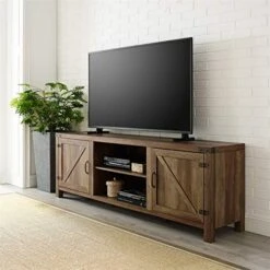 Pemberly Row 70" Farmhouse Barn Door Rustic Wood TV Stand Console With Storage In Rustic Oak
